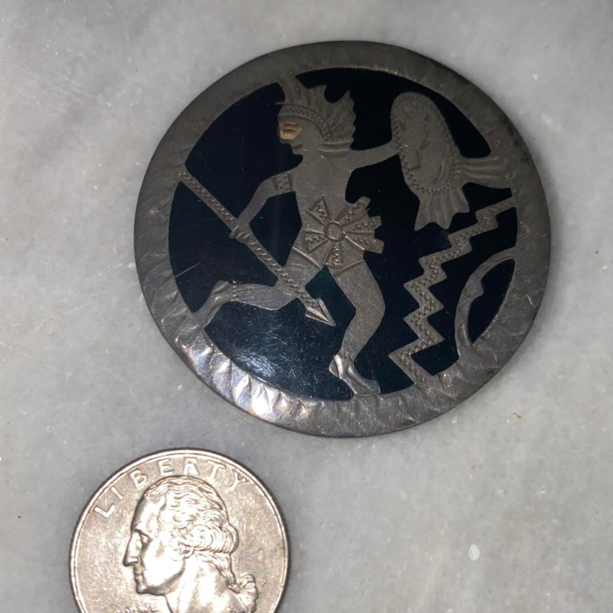mexican silver pin with warrior and zigzags